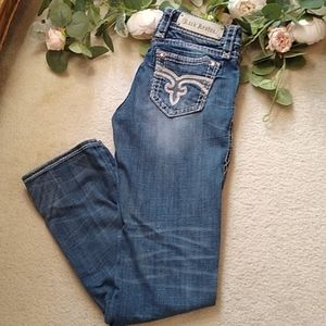 Rock Revival jeans with decorative pockets, distressing and extra stitching,